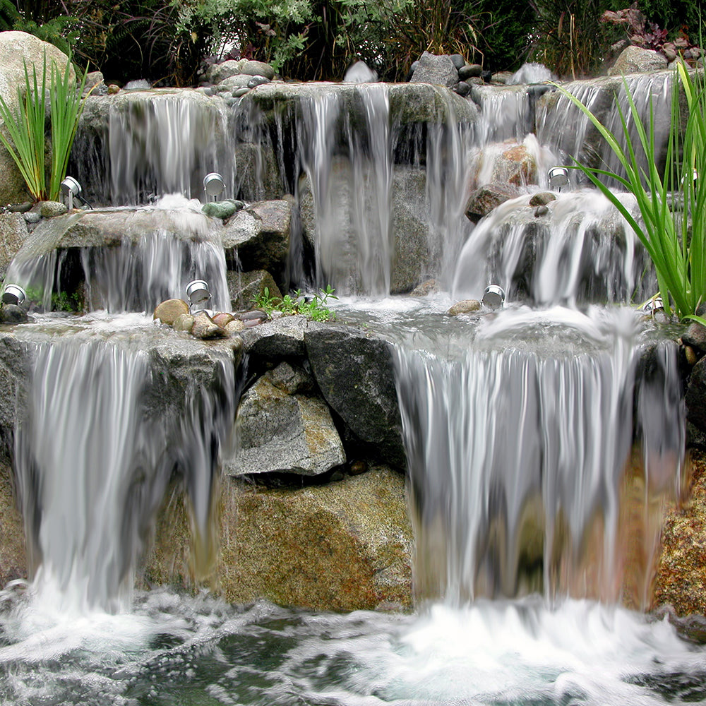 Cascading waterfalls over granite boulders built by Russell Watergardens