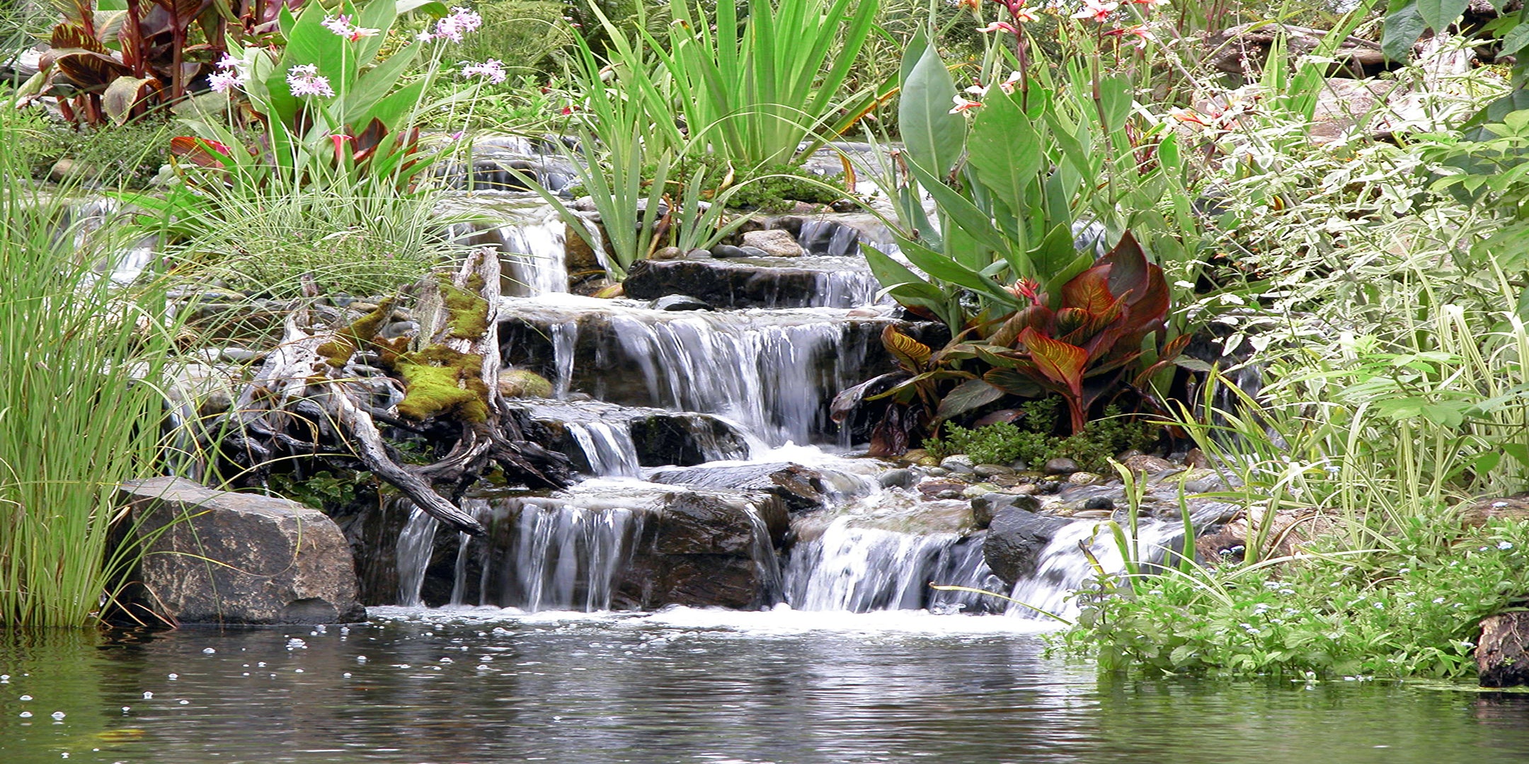 Beautiful multiple stepped waterfalls created by Russell Watergardens using Hydro Vortex waterfall filters