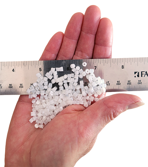 HydroBeads in a hand with a ruler to show size